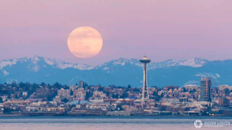 Moonrise over Seattle's Space Needle and the Cascade Mountains